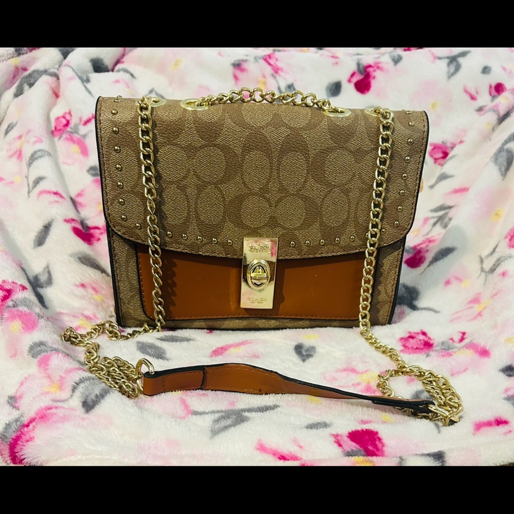 Tan and Brown Crossbody Bag with Embossed Pattern and Gold Clasp